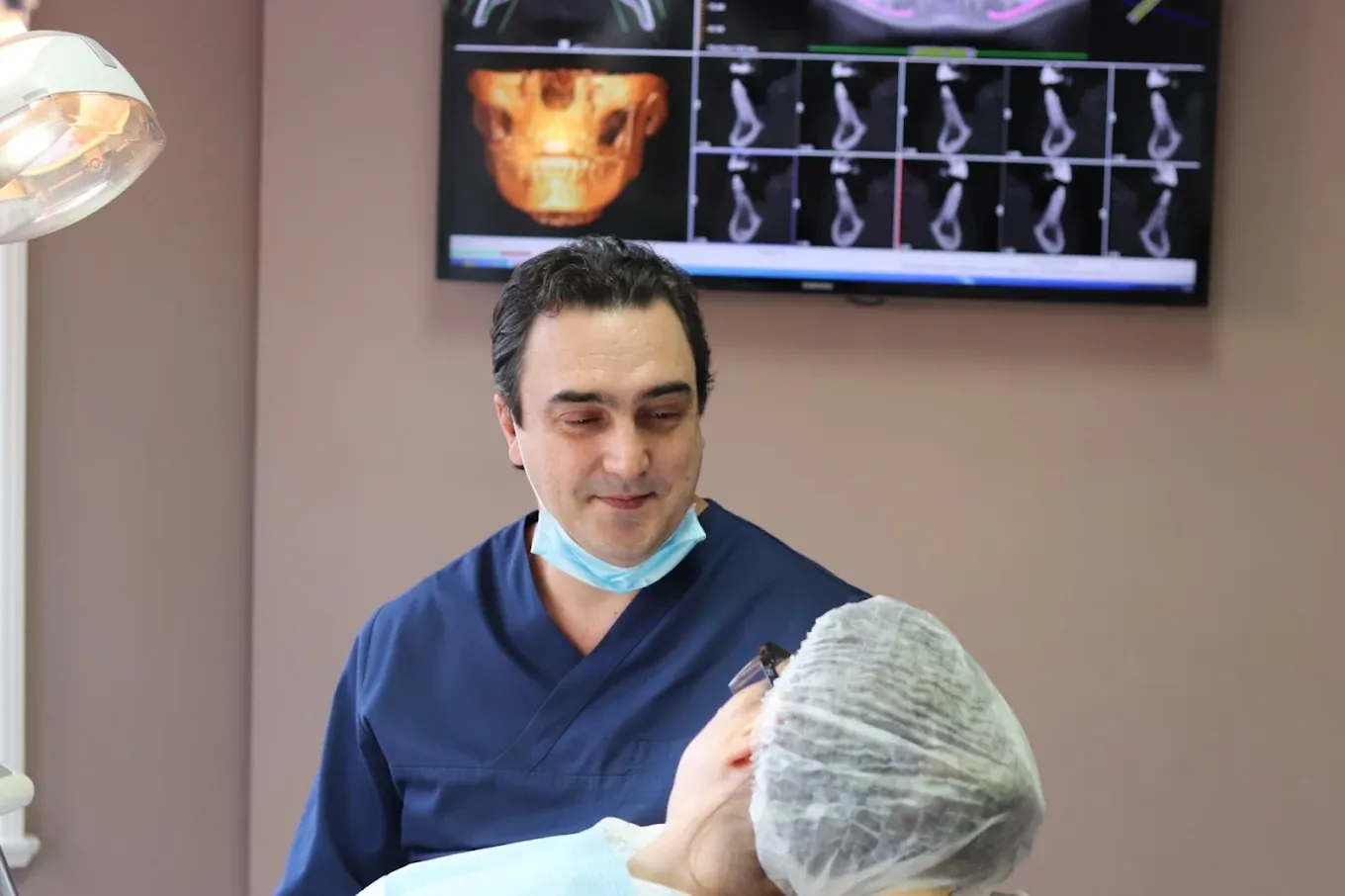 Dr Valdemir Muzulon caring for a patient at Brazilian Smile.