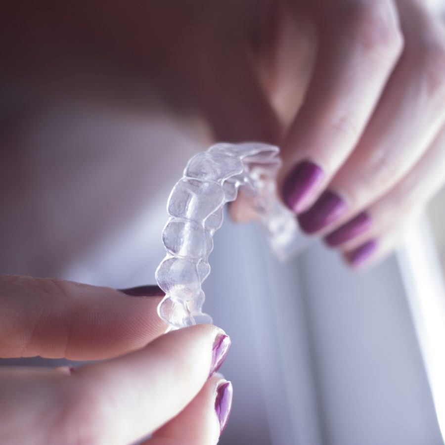 Clear dental teeth retainer brackets to straighten and align each tooth in modern dentistry technology.